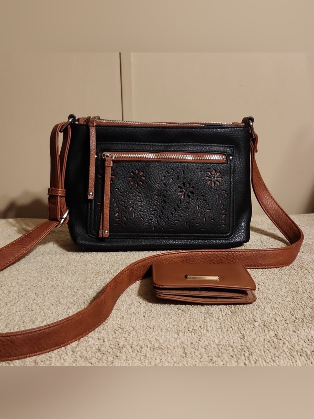 Black Crossbody Bag with Brown Trim and Floral Laser-Cut Pocket